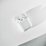 white apple earpods in white case